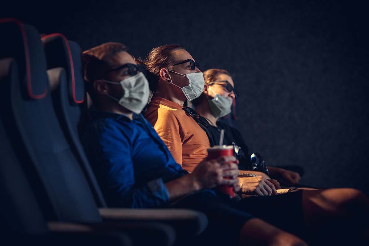 Cinema, movie theatre during quarantine. Coronavirus pandemic safety rules, social distance during movie watching